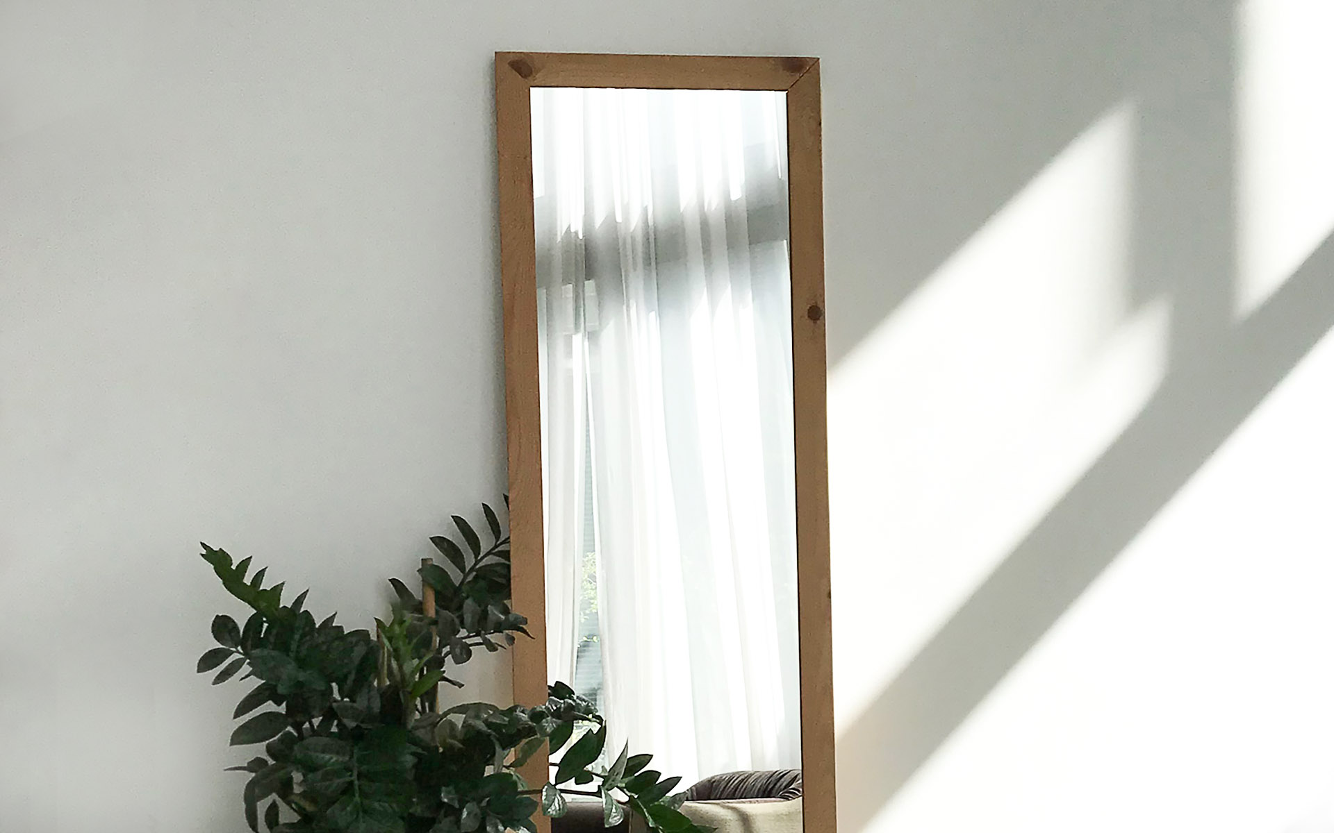pine mirror on wall